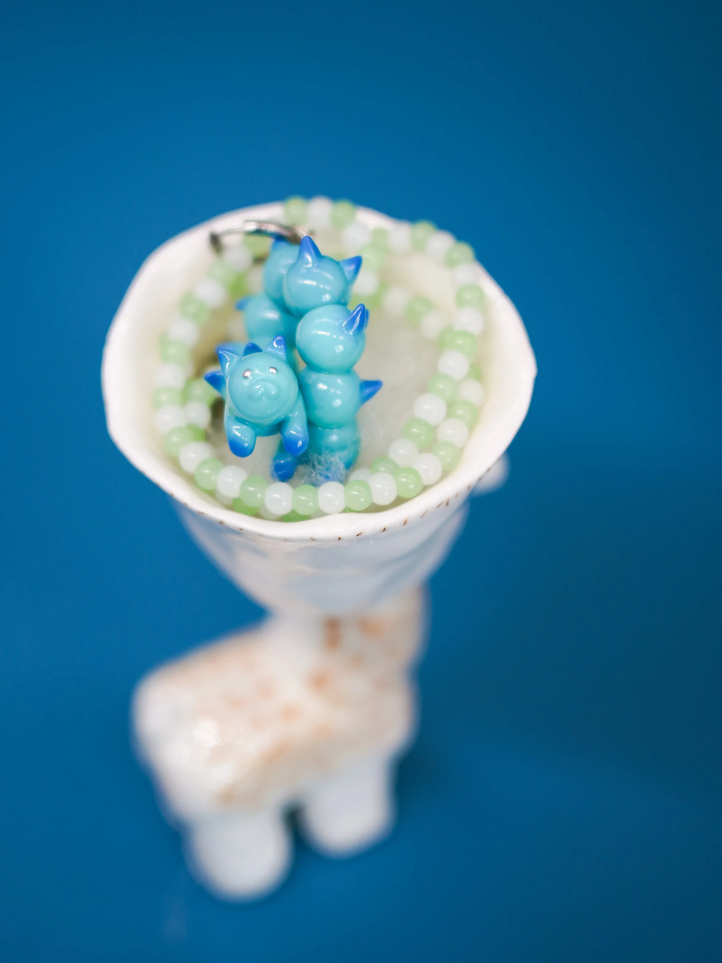Turquoise and blue catcaterpillar with lots of ears necklace & earring